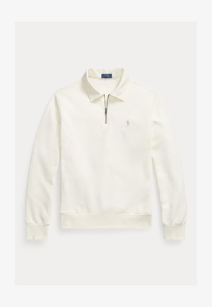 Kremfarget langermet polotrøye med kvart glidelås, krage, ribbestrikkede mansjetter og linning, og en liten brodert logo på venstre bryst.