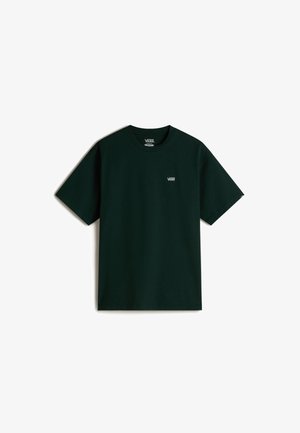 Maglietta a maniche corte di colore verde scuro in cotone. Presenta un piccolo logo bianco Vans sulla parte sinistra del petto. Design classico con colletto girocollo.