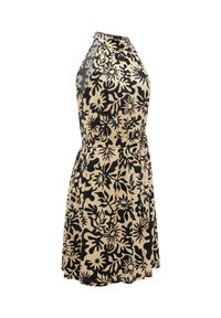 Ærmeløs beige kjole med sort abstrakt blomsterprint, halterneck, taljesyning og knælængde med svaj.