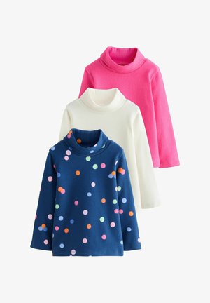 Drie lange mouwen, coltruien gestapeld: roze, wit en marineblauw met meerkleurige stippen op een witte achtergrond.