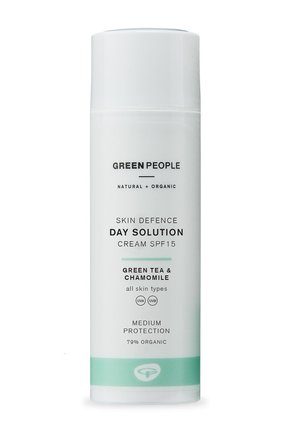 White cylindrical bottle labeled "Green People Skin Defence Day Solution Cream SPF15." Features light green accents, black text, and organic ingredients.