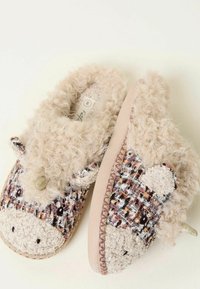 Cozy slippers with a textured beige upper, fuzzy trim, and a soft pink sole, featuring sheep-like details and woven patterns.
