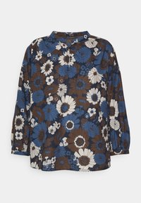Blusa a maniche lunghe in stampa floreale marrone, blu e bianca. Presenta un colletto alla coreana e un design ampio con una texture morbida.