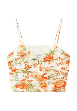 Top court blanc avec fines bretelles, motif floral orange et vert, tissu froncé et détail en dentelle au niveau du décolleté.