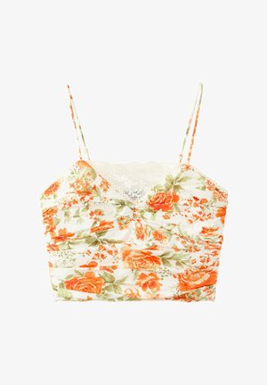 Top court blanc avec fines bretelles, motif floral orange et vert, tissu froncé et détail en dentelle au niveau du décolleté.