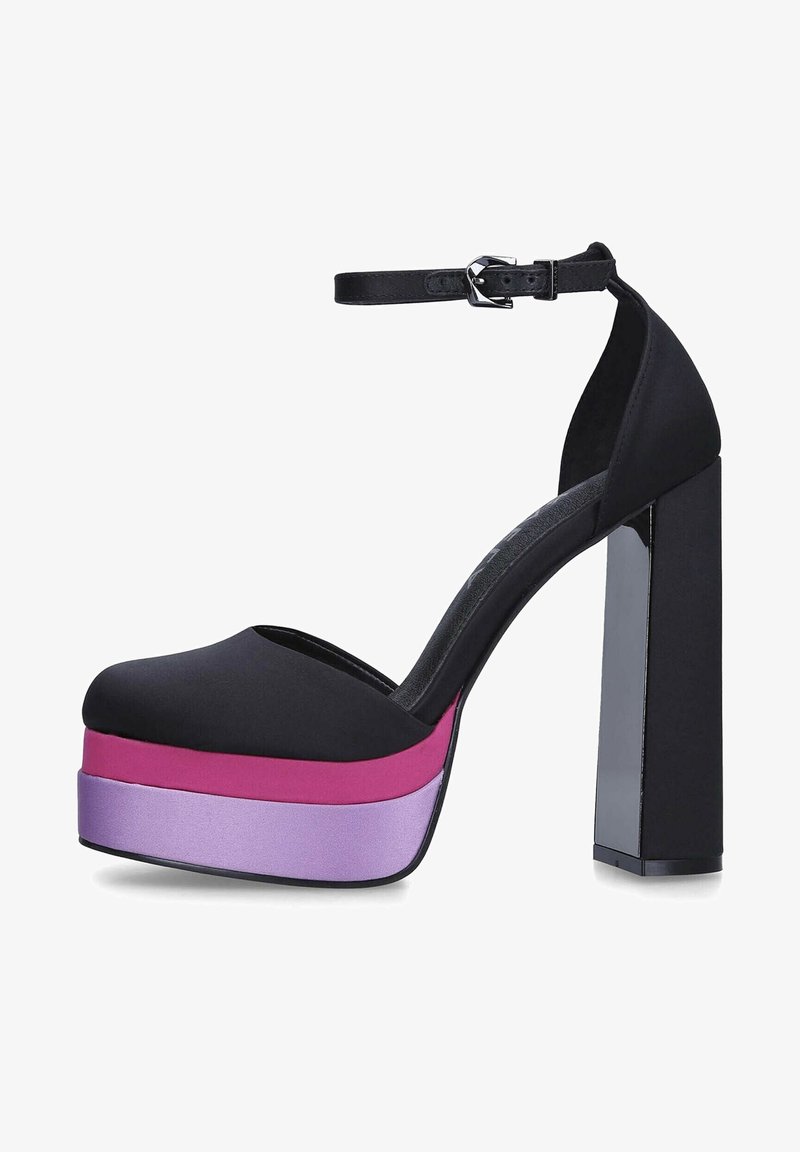 Black platform shoe with an ankle strap, featuring a chunky heel and a gradient midsole in pink and purple shades. Smooth texture.