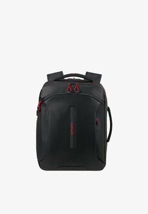 Black rectangular backpack with red zipper pulls, padded shoulder straps, top and side carry handles, and a front vertical logo strip.