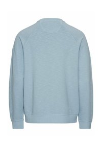 Hellblaues Sweatshirt aus strukturiertem Stoff, Raglanärmel, gerippte Bündchen und runder Halsausschnitt. Einfaches Design, keine Muster oder Verzierungen.