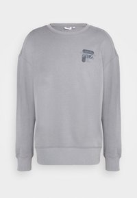 Šedá mikina s dlouhým rukávem, kulatým výstřihem, žebrovanými manžetami a lemem. Na levé části hrudi se nachází malá tištěná nálepka. Měkká textura.