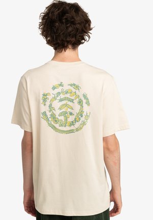 Cream-colored cotton t-shirt featuring a circular, multicolored nature-themed graphic, including plants and animals on the back.