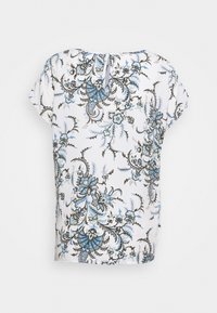 Top bianco con motivo floreale blu e nero. Maniche corte, scollatura rotonda e una piccola apertura a forma di chiave sul retro. Tessuto con una texture liscia.