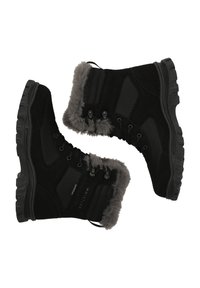 Svarta vattentäta stövlar med en krage av konstpäls, texturerade paneler och robusta sulor med framträdande greppmönster.