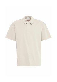 Polo shirt à manches courtes en beige clair, avec un col plat, une patte de boutonnage et une coupe décontractée en coton doux.