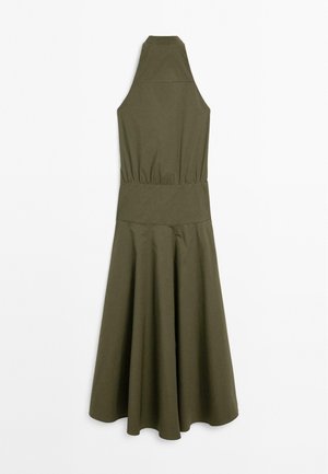 Olive green sleeveless dress with a high neckline, elastic waist, and flared skirt. Made of soft fabric with a smooth texture.