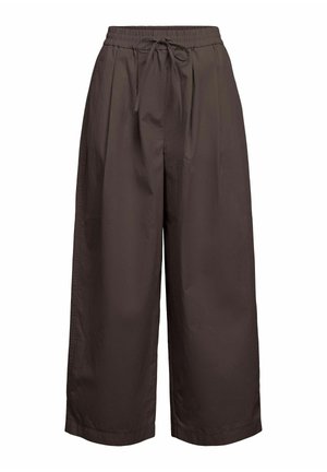 Loose-fit dark brown wide-leg trousers with elastic waistband and front drawstring tie, ankle-length.