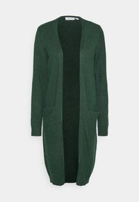 Pitkä vihreä neuletakki pehmeästä neuloksesta. Avoin etuosasuunnittelu, jossa kaksi etutaskua ja resorireunaiset hihansuut. Rakennepinta, rento tyyli.