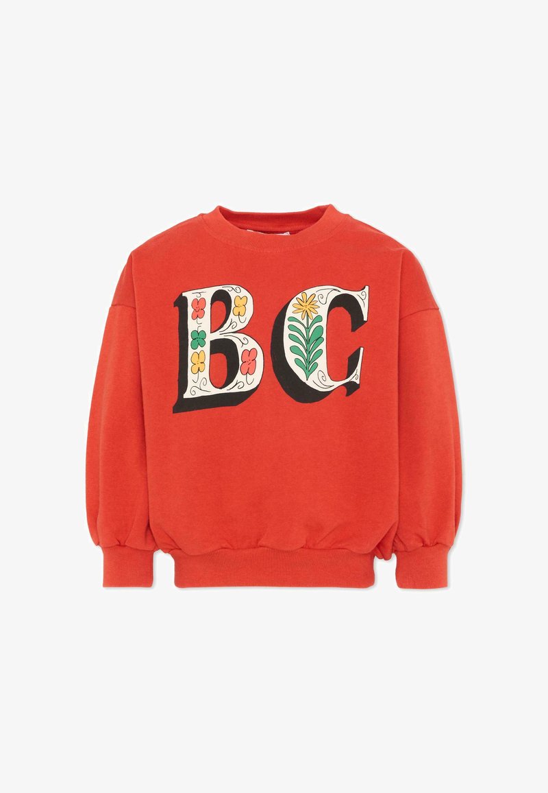 Sweat-shirt rouge avec de grandes lettres décoratives "B" et "C" ornées de motifs floraux colorés sur le devant, poignets et ourlet côtelés.