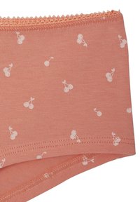 Pfirsichfarbener Stoff mit weißem Kirschmuster, ausgestattet mit einem welligen Bund und einer glatten Textur. Die Nähte sind ordentlich und gleichmäßig entlang der Kanten.