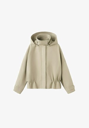 Veste à capuche beige clair avec manches longues, fermeture éclair frontale recouverte d'un rabat, taille élastique et poignets ajustables avec sangles.