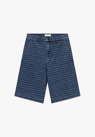 Blue denim shorts with white grid pattern, front button, belt loops, and side pockets, labeled "Wood Wood" on waistband.