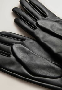 Black leather gloves with a smooth texture, featuring a four-channel design and stitch detailing on the back of the hand.