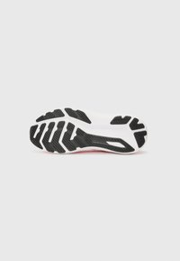 Black rubber outsole with deep grooves, featuring a white midsole. Textured surface for traction, no visible branding or patterns.