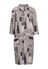 Gekraagde jurk in licht taupe met abstracte marineblauwe patronen, knoopsluiting en driekwartmouwen. Soepele, geweven stof met geometrische ontwerpen.