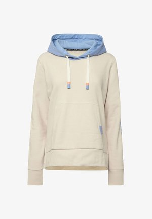 Krémová mikina s kapucí a světle modrou vnitřní kapucí. Obsahuje šňůrky s oranžovými a modrými konci, přední kapsu a žebrované manžety.