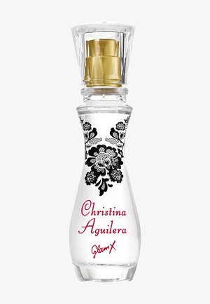 Bottiglia di profumo in vetro trasparente con design floreale nero, tappo spray dorato, etichettata "Christina Aguilera Glam X" in carattere corsivo rosso.