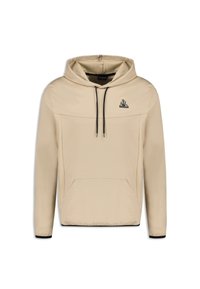 Sudadera con capucha beige hecha de un tejido suave, con cordones negros, bolsillo canguro en la parte frontal y un pequeño logo en el pecho.