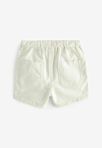 Lyse beige shorts med elastisk talje, to baglommer og en glat, bomuldsagtig tekstur. Enkel design uden synlige mønstre.
