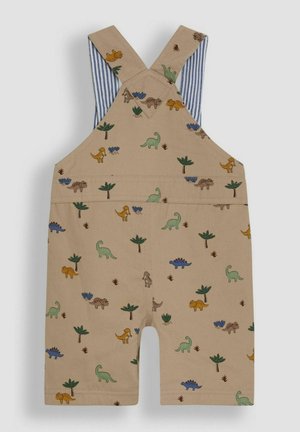 Beige korte overalls med dinosaur- og plante mønstre, med krydsede skulderstropper og blåstribede foringer indeni.
