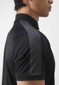 Peak Performance PLAYER - Poloshirts - black/motion grey