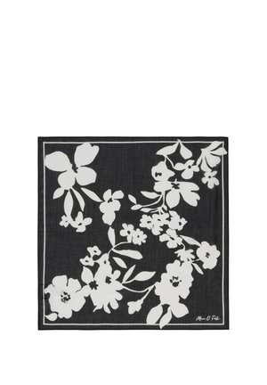 Black square scarf with white floral silhouette pattern and a thin white border, signed "Marc O Polo" in one corner.