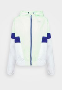 Lekka kurtka przeciwwiatrowa w neonowej zieleni i bieli z niebieskimi akcentami, kapturem, elastycznymi mankietami oraz zamkiem błyskawicznym z przodu. Ozdobiona odblaskowym logo.