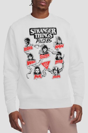 White sweatshirt featuring black and red graphic portraits of Stranger Things characters with their names and “Tales from ‘85” text.