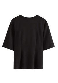 T-shirt nera a maniche corte con vestibilità rilassata, scollo rotondo, tessuto morbido e sottili cuciture laterali. Nessun logo o motivo visibile.