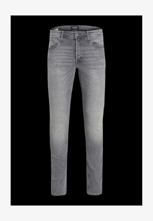 Pilki džinsai su siauru siluetu, su gradientiniu plaunimu, penkių kišenių dizainu ir klasikiniu mygtuko uždarymu. Lygus paviršius ir siuvimo detalės.