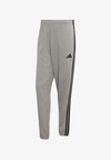 ESSENTIALS 3-STRIPES FRENCH TERRY TAPERED CUFFED PANTS - Pantalon de survêtement - medium grey heather/black