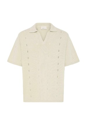 Cream short-sleeve knit polo shirt with open V-neck and subtle vertical lace patterns, made from lightweight textured fabric.