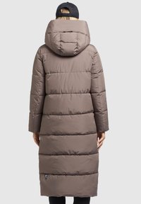 Long, padded coat in taupe with a hood, featuring horizontal quilted sections and a logo tag at the hem. Smooth texture and fitted sleeves.