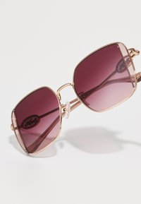 COACH Päikeseprillid - shiny rose gold/rose