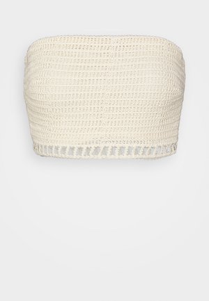 Lichtbeige gehaakt bandeau top met een gestructureerd ontwerp en een geschulpte rand aan de onderkant. Geen zichtbare bandjes of sluitingen.
