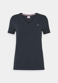 Granatowa bawełniana koszulka typu V-neck z krótkimi rękawami, z małym logo na piersi i kontrastowymi paskami wzdłuż dekoltu.