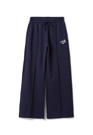 Pantaloni della tuta blu navy a gamba larga con fascia elastica in vita e coulisse, tasche frontali e logo bianco "NYC Attitude 1978" sulla coscia destra.