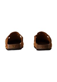 Brown leather sandals with a cork footbed, open back, and side cutouts. Textured surface with a low-profile heel.