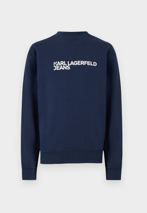 Marineblå genser med lange ermer, ribbestrikkede mansjetter og krage, med hvit "KARL LAGERFELD JEANS"-logo på brystet.