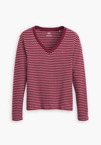 Burgundy long-sleeve top with white horizontal stripes. Features a V-neck design and a small red logo on the left chest. Soft texture.