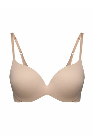 Nude molded bra with adjustable straps, smooth texture, and plunge design. Features seamless cups and minimalistic style without embellishments.
