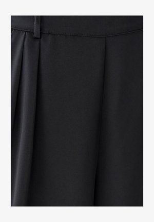 Black fabric with a smooth texture, featuring pleats and a clean waistband design. Simple and unembellished appearance.